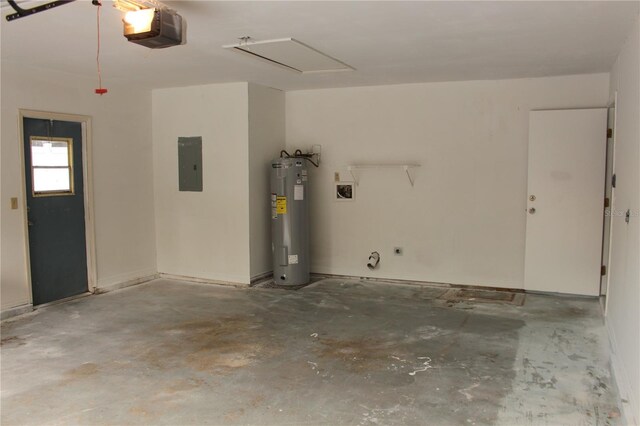 garage featuring electric water heater, a garage door opener, and electric panel