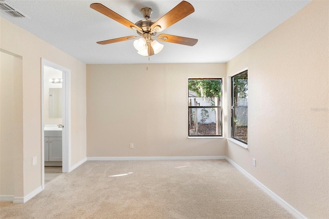 1550 Maxwell Ln, Deltona, FL 32738 - unfurnished bedroom featuring carpet floors, connected bathroom, baseboards, and a ceiling fan