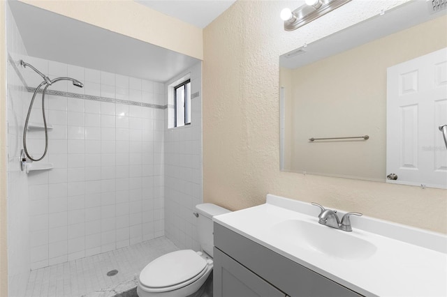 1550 Maxwell Ln, Deltona, FL 32738 - bathroom featuring toilet, a shower stall, a textured wall, and vanity