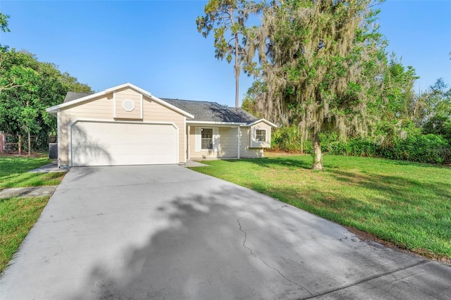 1550 Maxwell Ln, Deltona, FL 32738 - ranch-style home with an attached garage, a front lawn, and driveway