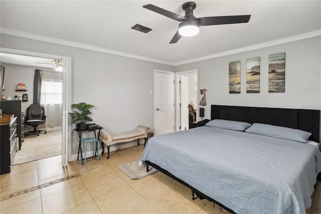 bedroom with an office area, ornamental molding, light tile patterned floors, and a ceiling fan