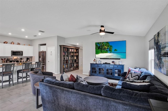 208 Summerlin Ln, Haines City, FL 33844 - living room featuring ceiling fan, lofted ceiling, and recessed lighting