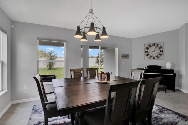 208 Summerlin Ln, Haines City, FL 33844 - dining area featuring a chandelier and baseboards