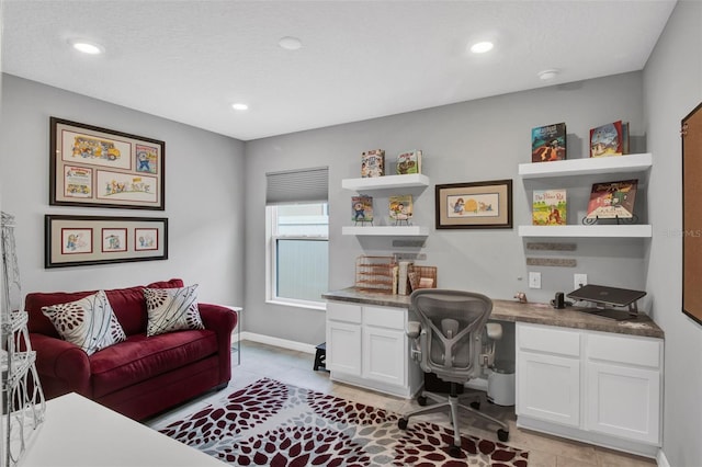 208 Summerlin Ln, Haines City, FL 33844 - office area with built in desk, light tile patterned floors, recessed lighting, and baseboards