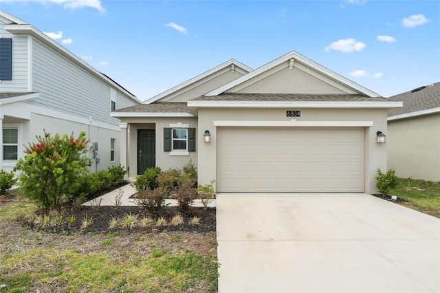 6834 Wilson Hammock Ave, Groveland, FL 34736 - single story home featuring stucco siding, an attached garage, driveway, and roof with shingles