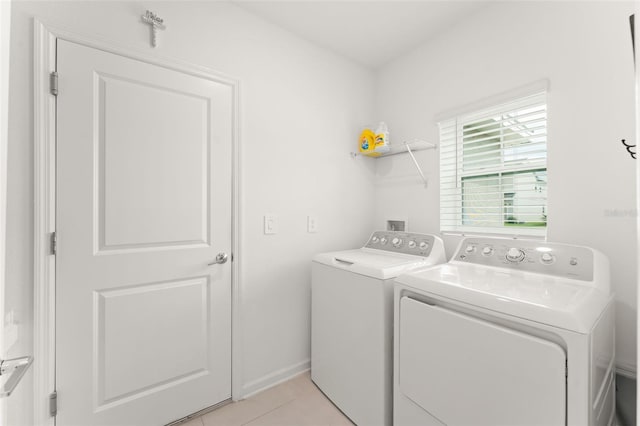 6834 Wilson Hammock Ave, Groveland, FL 34736 - washroom featuring independent washer and dryer and light tile patterned floors