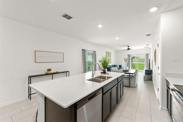 6834 Wilson Hammock Ave, Groveland, FL 34736 - kitchen with a sink, stainless steel appliances, light countertops, open floor plan, and recessed lighting