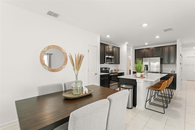 6834 Wilson Hammock Ave, Groveland, FL 34736 - dining room featuring recessed lighting, light tile patterned floors, and baseboards