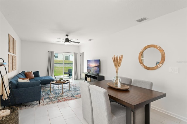 6834 Wilson Hammock Ave, Groveland, FL 34736 - living room featuring a ceiling fan and baseboards