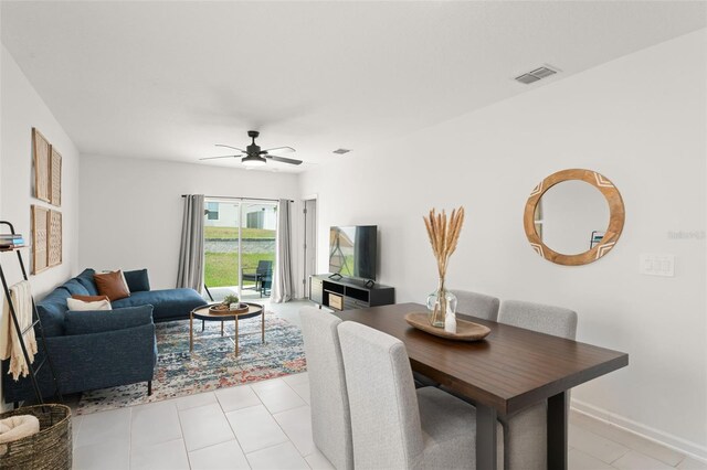 6834 Wilson Hammock Ave, Groveland, FL 34736 - living area with ceiling fan and baseboards
