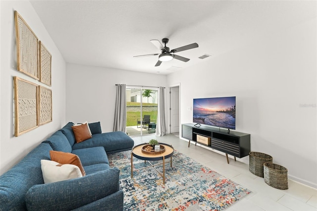 6834 Wilson Hammock Ave, Groveland, FL 34736 - tiled living area featuring a ceiling fan and baseboards