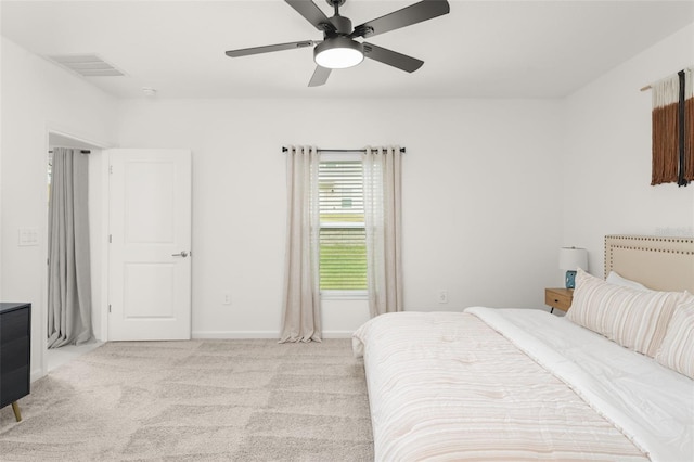 6834 Wilson Hammock Ave, Groveland, FL 34736 - bedroom featuring light colored carpet, a ceiling fan, and baseboards