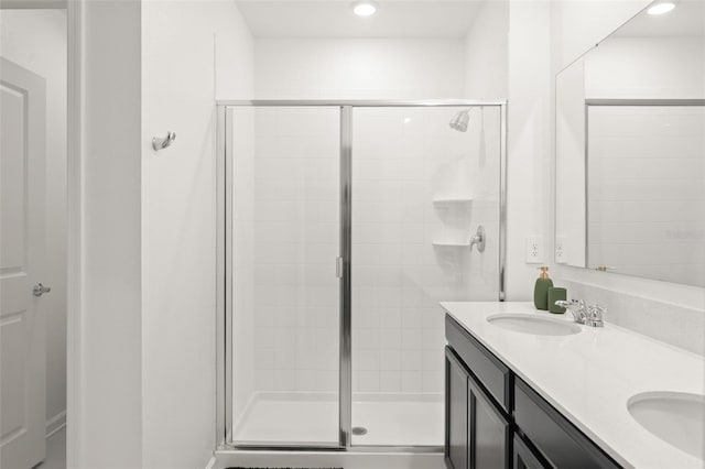 6834 Wilson Hammock Ave, Groveland, FL 34736 - full bathroom with a shower stall, double vanity, and recessed lighting