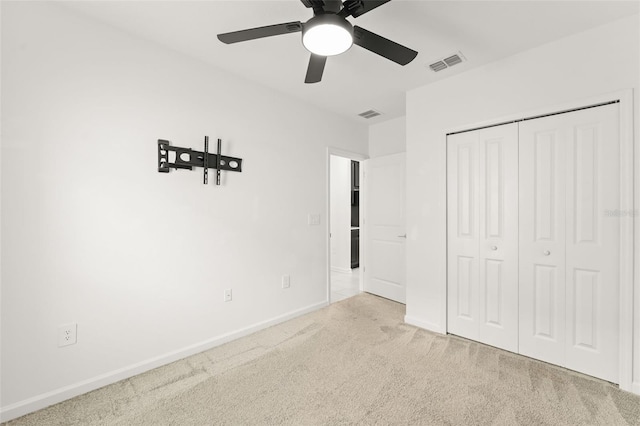 6834 Wilson Hammock Ave, Groveland, FL 34736 - unfurnished bedroom featuring carpet flooring, baseboards, a closet, and a ceiling fan