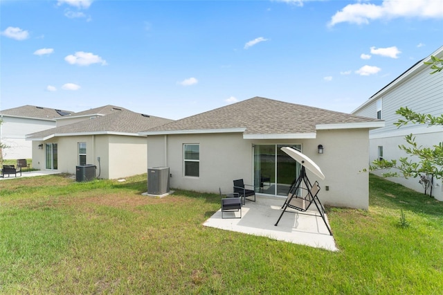 6834 Wilson Hammock Ave, Groveland, FL 34736 - rear view of property with central AC, a shingled roof, a patio area, and stucco siding