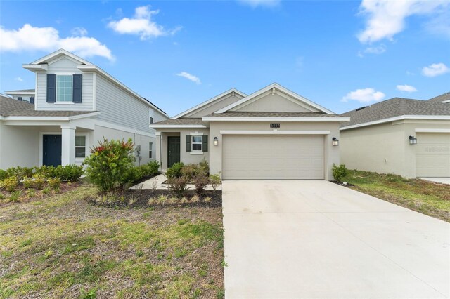 6834 Wilson Hammock Ave, Groveland, FL 34736 - ranch-style house with a garage, stucco siding, roof with shingles, and concrete driveway