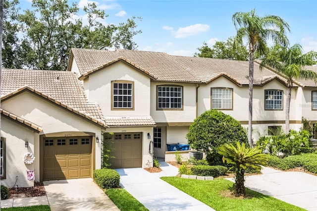 2498 Saint Augustine Blvd, Haines City, FL 33844 - view of front facade featuring stucco siding, a tile roof, driveway, and central AC unit
