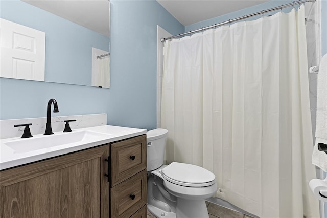 2498 Saint Augustine Blvd, Haines City, FL 33844 - bathroom with toilet, vanity, and tile patterned flooring