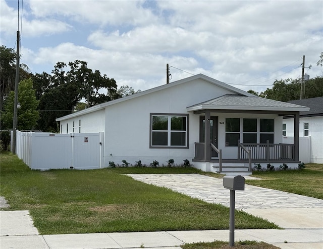 1040 20th St, Orlando, FL 32805 - view of front of house featuring covered porch, a gate, and roof with shingles