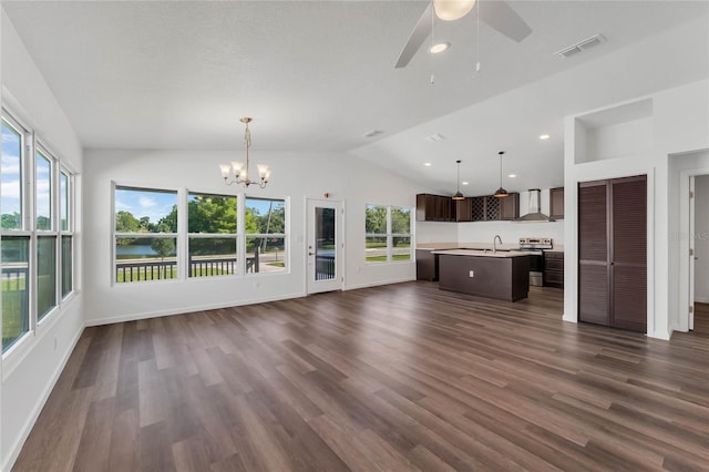 1040 20th St, Orlando, FL 32805 - unfurnished living room with lofted ceiling, a sink, plenty of natural light, ceiling fan, and a chandelier