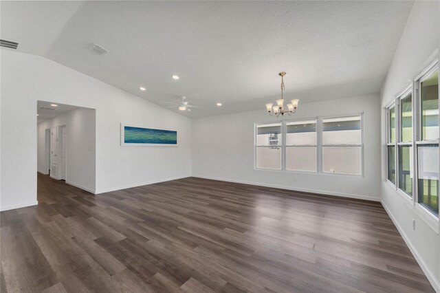 1040 20th St, Orlando, FL 32805 - unfurnished room featuring lofted ceiling, a chandelier, a ceiling fan, dark wood-style floors, and baseboards