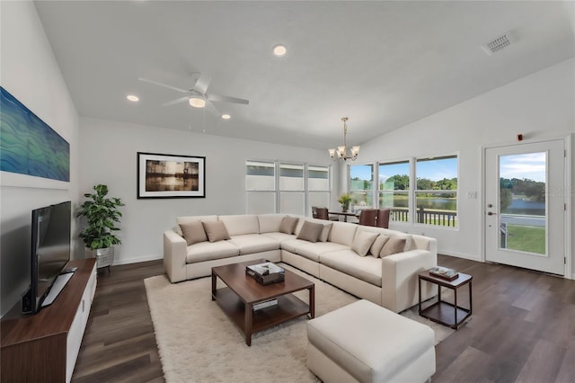1040 20th St, Orlando, FL 32805 - living room with a chandelier, recessed lighting, baseboards, dark wood-type flooring, and lofted ceiling