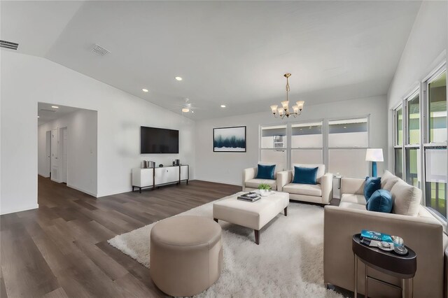 1040 20th St, Orlando, FL 32805 - living room with lofted ceiling, a chandelier, wood finished floors, recessed lighting, and a ceiling fan