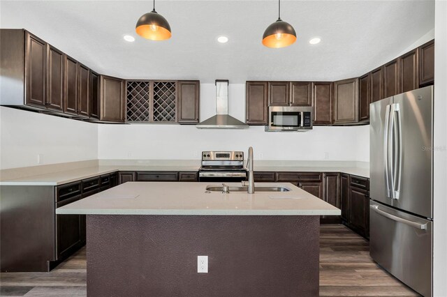 1040 20th St, Orlando, FL 32805 - kitchen featuring stainless steel appliances, wall chimney exhaust hood, a sink, dark wood-style flooring, and dark brown cabinets