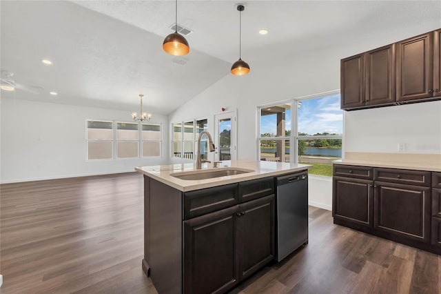 1040 20th St, Orlando, FL 32805 - kitchen featuring a sink, dishwasher, light countertops, dark wood-style floors, and lofted ceiling