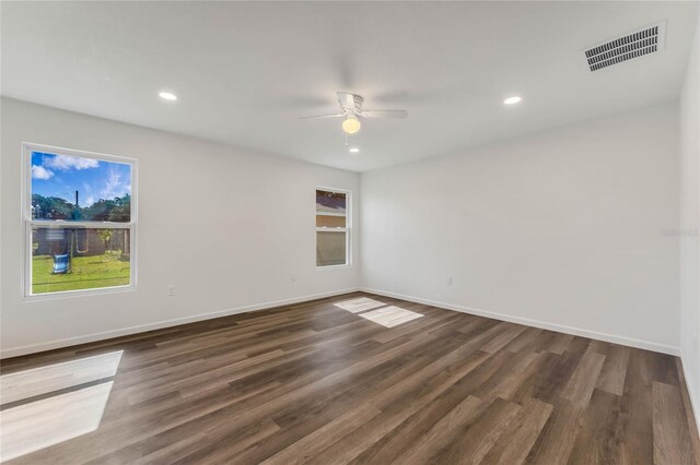 1040 20th St, Orlando, FL 32805 - empty room featuring a ceiling fan, dark wood-style flooring, recessed lighting, and baseboards