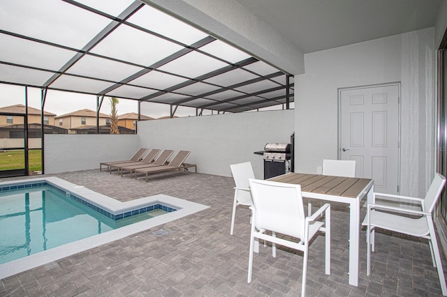8944 Sydney Ave, Kissimmee, FL 34747 - outdoor pool with a patio area, a jacuzzi, area for grilling, and a lanai