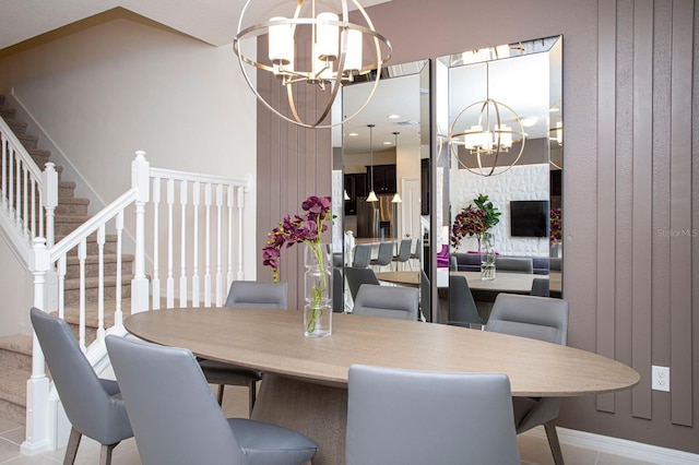 8944 Sydney Ave, Kissimmee, FL 34747 - dining space featuring a chandelier, stairs, and baseboards