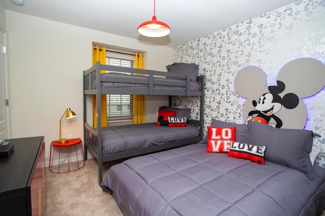 8944 Sydney Ave, Kissimmee, FL 34747 - carpeted bedroom featuring wallpapered walls, baseboards, and an accent wall