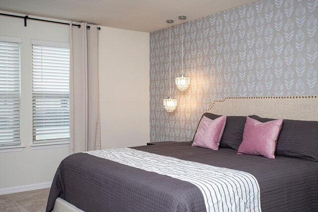 8944 Sydney Ave, Kissimmee, FL 34747 - bedroom with wallpapered walls, carpet, and baseboards