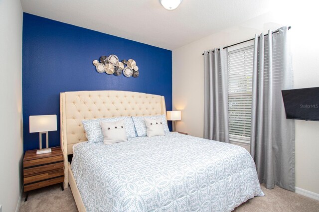 8944 Sydney Ave, Kissimmee, FL 34747 - carpeted bedroom with baseboards