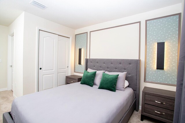 8944 Sydney Ave, Kissimmee, FL 34747 - bedroom featuring a closet, light colored carpet, and baseboards