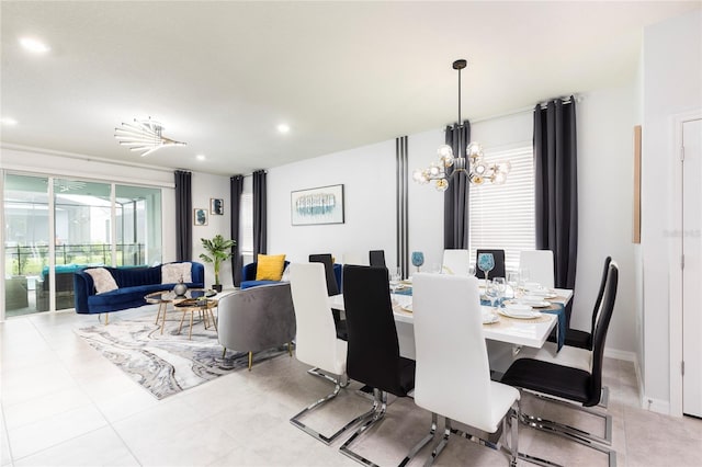 dining room featuring a chandelier and recessed lighting