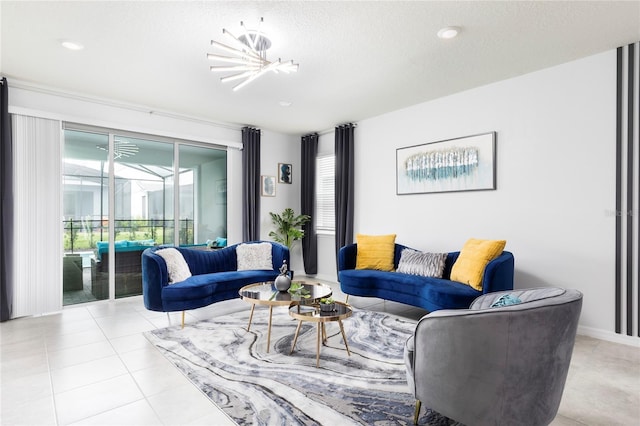 living room with a chandelier, a textured ceiling, and light tile patterned flooring