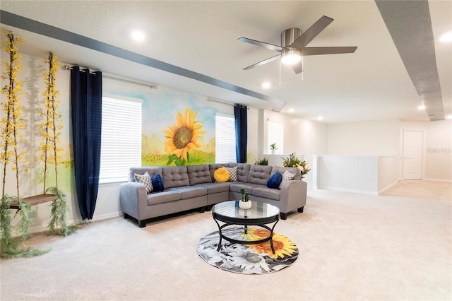 living area featuring carpet, baseboards, plenty of natural light, and recessed lighting