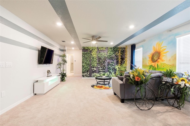 living area with light colored carpet, recessed lighting, ceiling fan, and baseboards