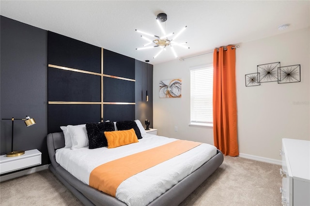 bedroom with light colored carpet, a ceiling fan, and baseboards