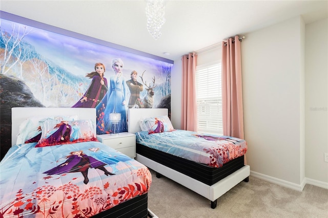carpeted bedroom with baseboards
