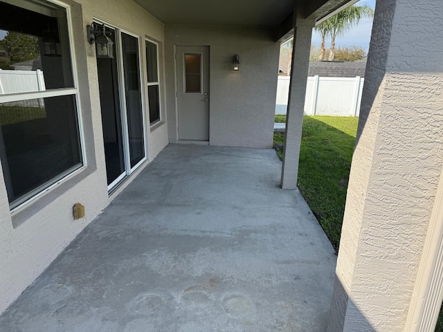 view of patio / terrace featuring fence