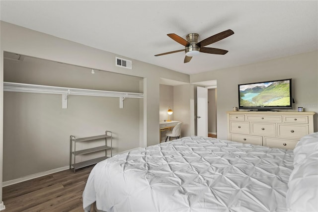 bedroom with dark wood-style floors, baseboards, a closet, and ceiling fan