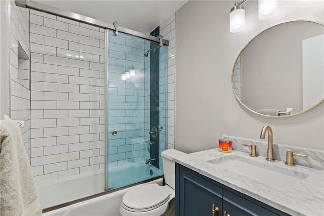 full bath with shower / bath combination with glass door, vanity, and toilet