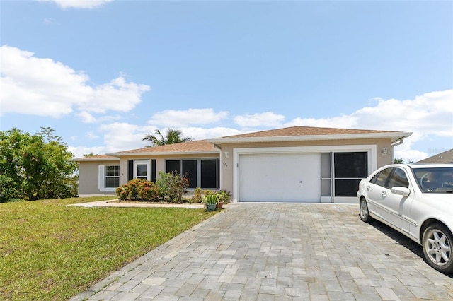 497 Lafayette St SW, Palm Bay, FL 32908 - ranch-style house featuring an attached garage, stucco siding, a front lawn, and decorative driveway
