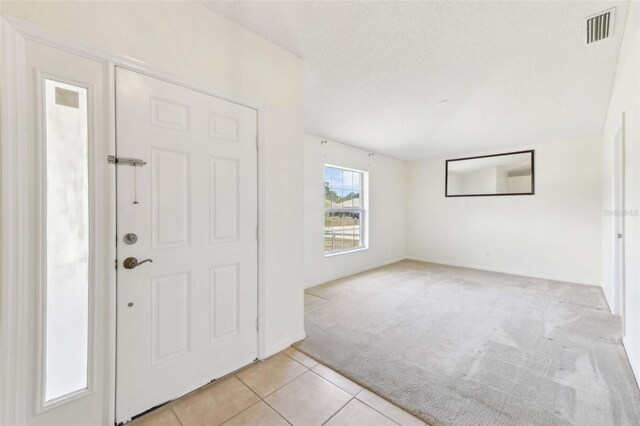 497 Lafayette St SW, Palm Bay, FL 32908 - foyer with light colored carpet and light tile patterned flooring