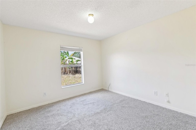 497 Lafayette St SW, Palm Bay, FL 32908 - unfurnished room with carpet, a textured ceiling, and baseboards
