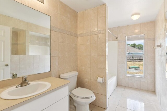 497 Lafayette St SW, Palm Bay, FL 32908 - full bath featuring tile walls, tile patterned floors, vanity, toilet, and bathing tub / shower combination