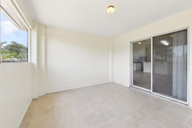 497 Lafayette St SW, Palm Bay, FL 32908 - spare room with light tile patterned flooring and baseboards
